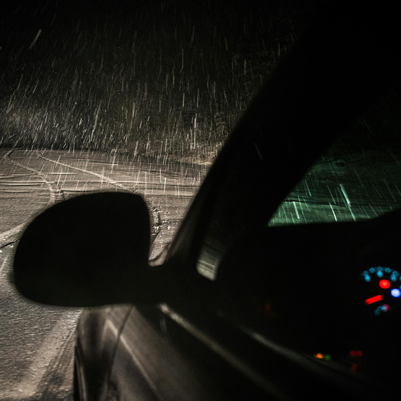 Mechanic checking vehicle battery
